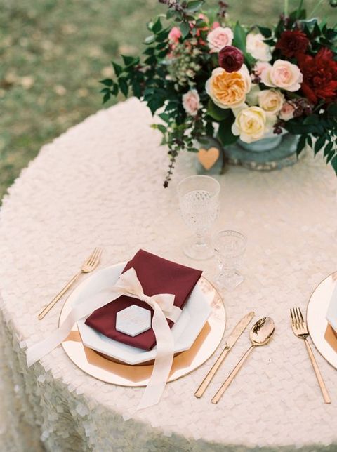 glam table setting with burgundy and blush details