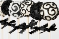26 black and white pops with bows as favors
