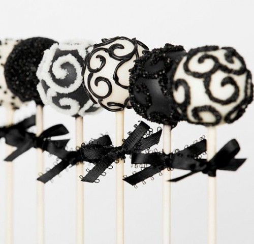 black and white pops with bows as favors