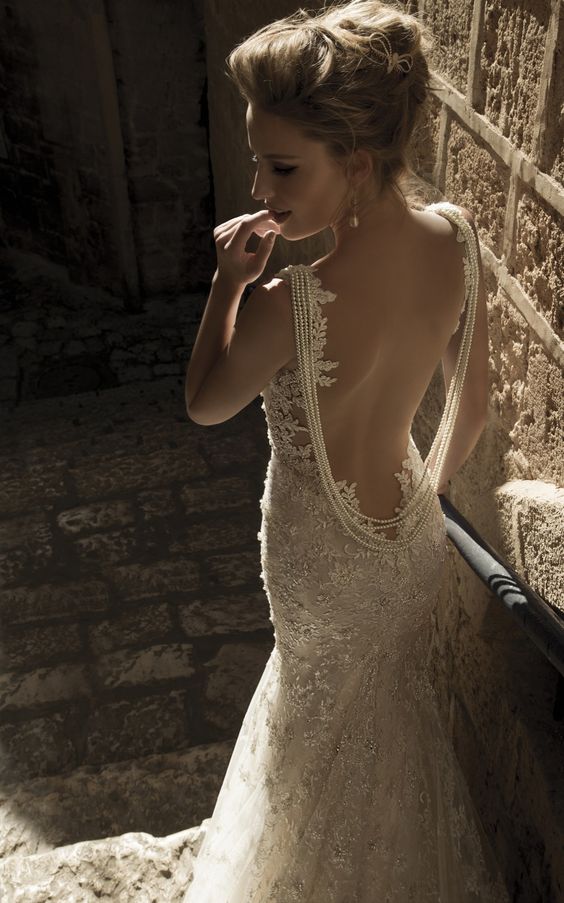 lace open back highlighted with a back necklace