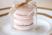 28 blush macarons with a glitter gold bow