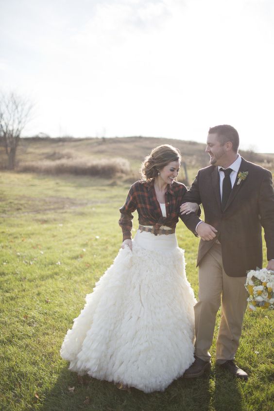 red plaid shirt over a gorgeous wedding gown