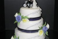 Beautiful cake with cake topper and flowers