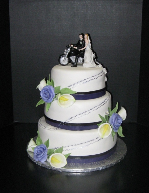 Beautiful cake with cake topper and flowers