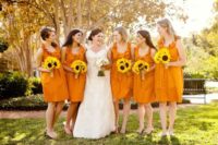 Bridesmaids looks with ruffle knee length dresses flats and sunflower bouquets