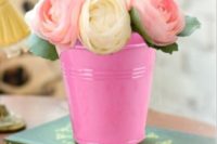 Bright pink bucket with yellow and pink roses