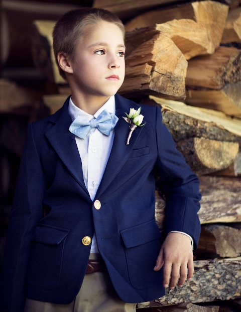 Elegant look with navy blue jacket, white shirt, light blue bow tie and beige pants
