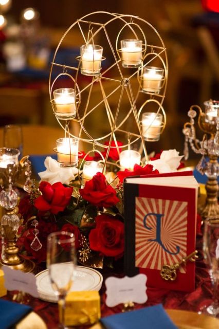 Table centerpiece with carousel candle holder and red roses