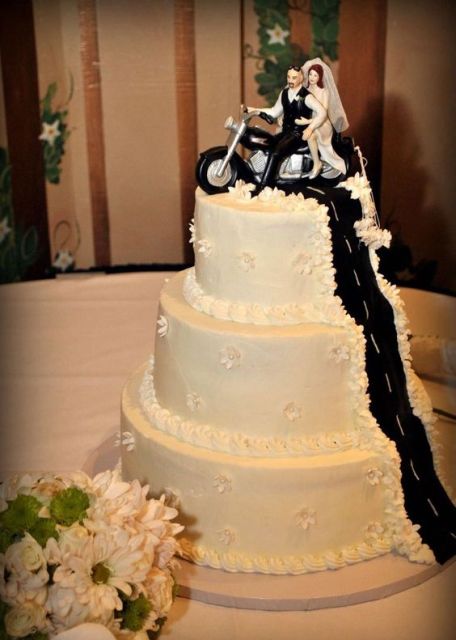 Three tiered cake with original cake topper