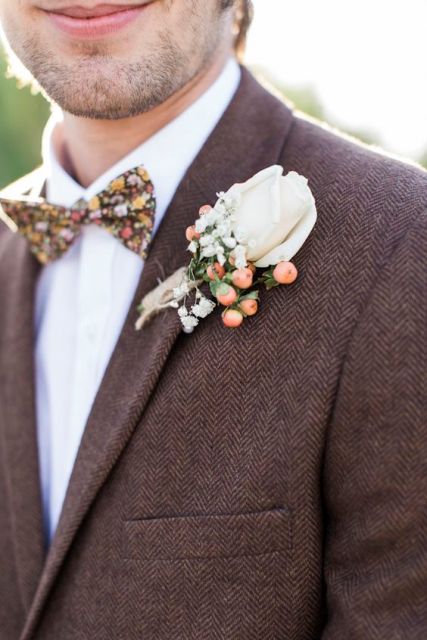 With floral bow tie and cute boutonniere