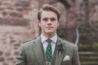 With tweed waistcoat, green tie with print