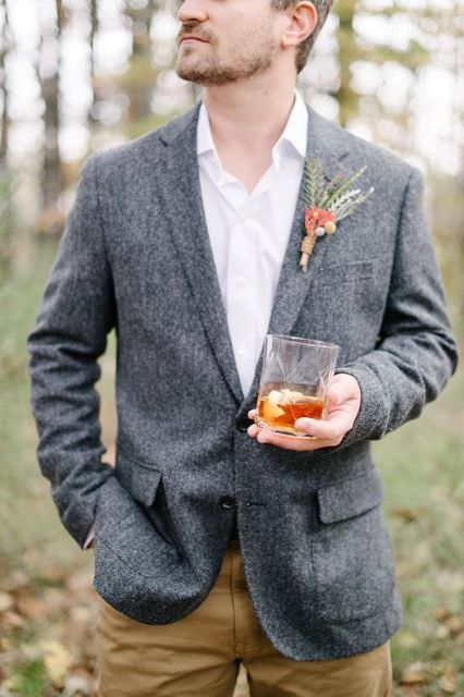 With white shirt, brown trousers and fall styled boutonniere