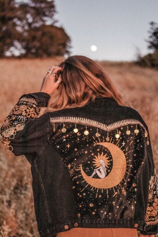 a black denim jacket with embroidery, coins, various applique is a lovely idea for a celestial bride