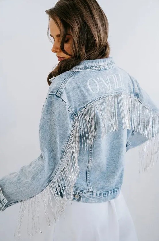 a blue denim bridal jacket with the new second name and long crystal fringe for a glam and boho feel at the same time