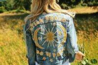 a blue denim jacket customized with yelow appliques to make its look boho and non-typical
