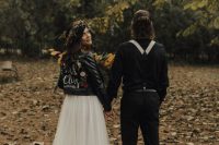 a boho bridal look with a black painted leather jacket and a floral crown, a tulle skirt with a train is a great idea for the fall