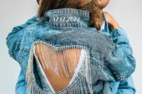 a grey denim jacket with a cutout heart and long crystal fringe plus a wedding date is a creative idea for a wedding