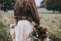 a romantic blush wedding dress, brown leather booties and a brown leather jacket are a chic boho combo that can be rocked in the fall or winter