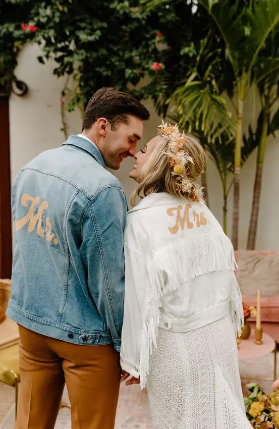 a white denim jacket with gold painted letters and white fringe is a stylish and easy to DIY idea for a bride