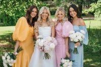 beautiful mismatching pastel maxi bridesmaid dresses plus white strappy shoes for a lovely spring wedding