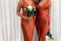 chic matching burnt orange satin maxi bridesmaid dresses with mermaid silhouettes and V-necklines are amazing