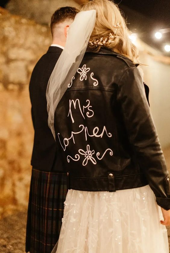 customize your black leather jacket with white calligraphy and blooms to make it ultimate and pair it up with your wedding dress