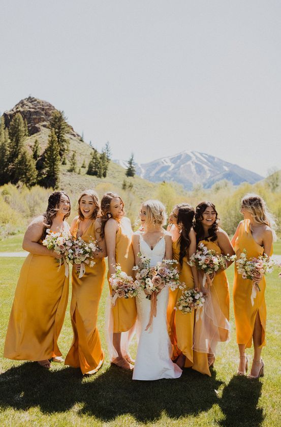 fab bold yellow mismatched bridesmaid dresses of various lengths for a summer or fall wedding