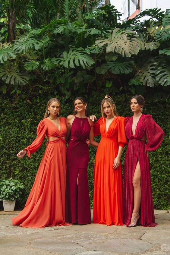 fabulously stylish and refined maxi bridesmaid dresses in burgundy and orange, with mismatching designs are wow