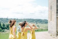 gorgeous light yellow maxi bridesmaid dresses with side slits and catchy tie up backs