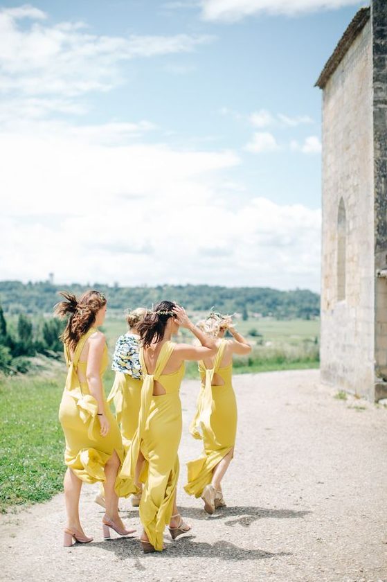 gorgeous light yellow maxi bridesmaid dresses with side slits and catchy tie up backs