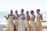 lovely and breezy pale yellow maxi bridesmaid dresses with slits and straps are great for a tropical wedding