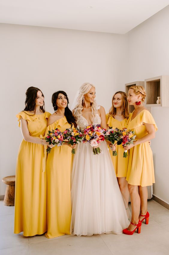 lovely mismatching ruffle yellow bridesmaid dresses, red jewelry and shoes for a bold and catchy summer wedding