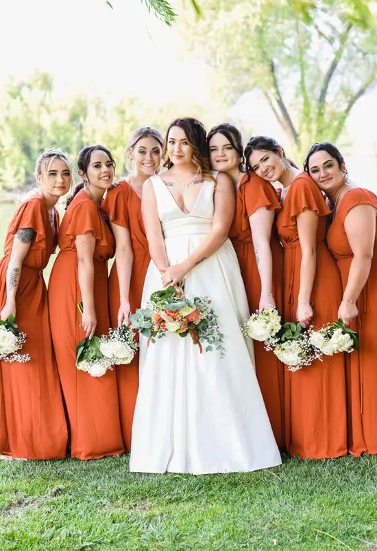 matching burnt orange maxi bridesmaid dresses with short ruffle sleeves are a pretty solution for a fall wedding in bright shades