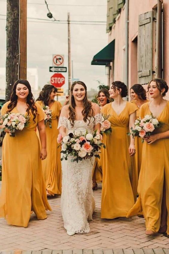 matching maxi marigold bridesmaid dresses with V-necklines and slits are cool for summer and fall weddings