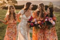 matching orange floral semi-fitting bridesmaid dresses with ruffle sleeves for a cheerful summer wedding