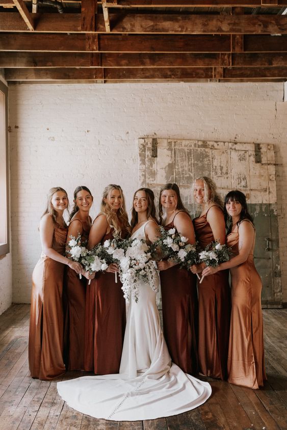 matching slip amber and brown maxi bridesmaid dresses are great for a summer or fall wedding