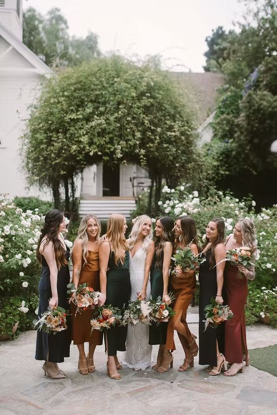 midi slip bridesmaid dresses in fall shades - amber, dark green, brown for a chic and stylish fall wedding