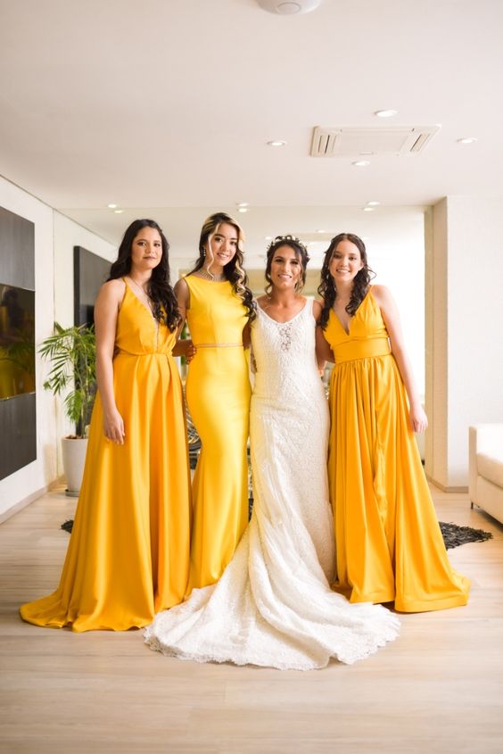 mismatched maxi bold yellow bridesmaid dresses are a super cool and catchy idea for a bright summer wedding