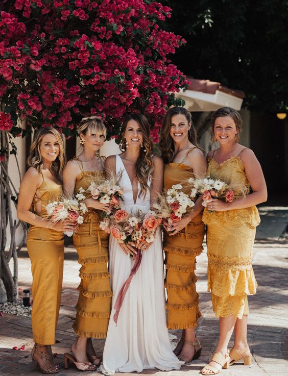 mismatched mustard yellow bridesmaid dresses with nude shoes are a cool idea for a bright wedding