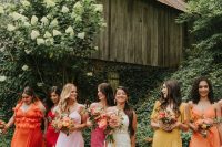 mismatched yellow, orange, pink maxi bridesmaid dresses to compose a bold mix and match bridal party look