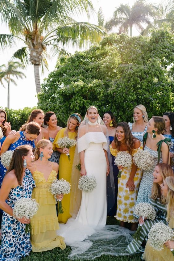 mismatching blue and yellow printed bridesmaid dresses are perfect for a blue and yellow wedding