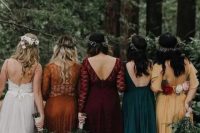 mismatching bold-colored maxi bridesmaid dresses in yellow, dark green, burgundy and orange, of plain fabric and lace for a fall wedding