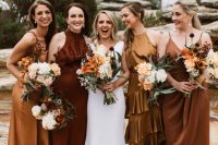 mismatching ddep red and mustard midi bridesmaid dresses wih nude shoes for a fall wedding