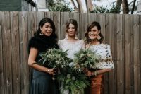 mismatching green and brown bridesmaid dresses and mismatching coverups for an ultimately stylish bridesmaid look