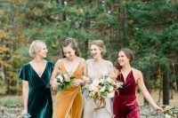 mismatching jewel tone bridesmaid dresses of velvet – an emerald, burgundy and mustard one are fantastic for a fall wedding in bright shades