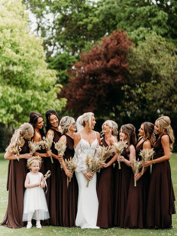 mismatching maxi bridesmaid dresses in a deep brown shade for a formal and elegant fall wedding