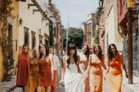 mismatching midi and maxi yellow and orange bridesmaid dresses and nude shoes for a summer wedding