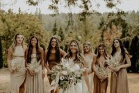 mismatching off-white, greige and brown midi bridesmaid dresses for a neutral boho wedding