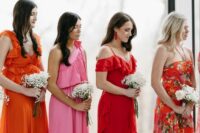 mismatching orange and pink maxi and midi bridesmaid dresses with ruffles and floral prints for a chic and cute bridal party look