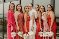 mismatching orange, pink and rust midi and maxi bridesmaid dresses for a bold mismatched bridal party look